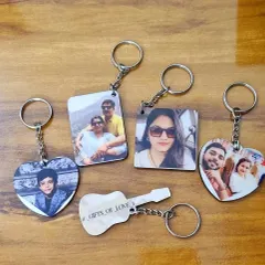 A closer look at the variety of MDF photo keychains I offer. You can choose from different shapes like hearts and squares, and I can print your photo on one or both sides.