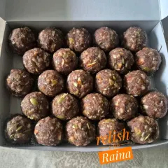 A box of my Ragi (Nachni) Laddoos, packed with dry fruits like almonds, walnuts, cashews, and pumpkin seeds. Ragi is a superfood rich in calcium and iron.
