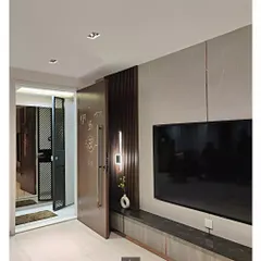 This view shows the main entrance and TV unit from our Pote Residence project. The design emphasizes clean lines, with a floating console and subtle rose gold inlays that add a touch of understated luxury.