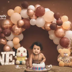 Turning one is a huge milestone, and we celebrate it with a bang. This cake smash session is set against a beautiful balloon arch, capturing the pure joy and curiosity of your little one's first taste of birthday cake.