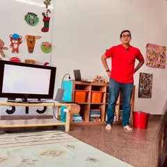 We believe in the power of community, and our training sessions often include parents who are experts in their fields. Here, a parent leads a workshop on using AI in education, bringing new perspectives to our team.