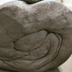 A close-up look at spiral kneading, an essential first step to prepare stoneware clay. This process removes air bubbles and creates a uniform consistency, ensuring the clay is ready for the wheel.