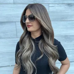 Another angle of the cool-toned summer balayage. This view shows how the ashy blonde highlights are seamlessly blended from the darker roots for a sophisticated and modern look.
