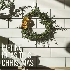 Gifting ideas for the festive season. A handmade wreath hangs on our tiled wall, representing the simple, natural, and beautiful gifts you can find here.