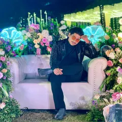 "To sit on the throne full of roses, you must also bear the thorns." A shot of me relaxing between hosting duties, reflecting on the grit and effort that goes into creating elegant events.