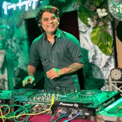 A smile on my face and my hands on the console. This is me in my element, completely focused on the music and the energy of the room. I believe spreading happiness starts with loving what you do.