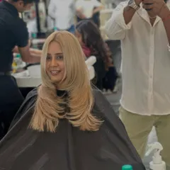 A stunning, sleek blonde look. This layered cut is designed to be styled pin-straight to show off the clean lines and the beautiful, bright color.