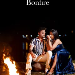 A cozy and intimate bonfire shoot by the water. The warm glow of the fire creates a romantic atmosphere, perfect for a relaxed and heartfelt pre-wedding session.