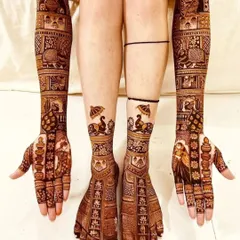A complete bridal look is essential. I design matching patterns for both hands and feet, ensuring your mehndi is perfect from every angle. This full bridal henna set features traditional motifs with a clean, symmetrical finish.