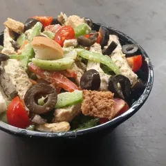 A side view of the same chicken salad, showing the generous portion size. These salads are designed to be a full meal that keeps you satisfied.