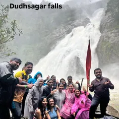 Another happy group at Dudhsagar falls, posing with our flag. The energy here is always incredible, especially during the peak monsoon season.