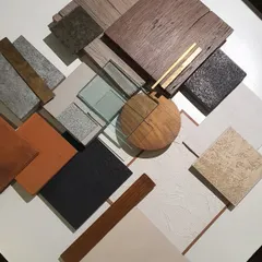 A flat lay of a material palette for a retail project. This moodboard combines wood, stone, glass, and metal samples, helping us and the client visualize the tactile and aesthetic qualities of the final space.