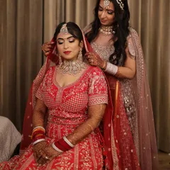 A candid moment between sisters on the wedding day. I had the honor of doing the makeup for both the bride and her sister, ensuring their looks were coordinated yet unique.