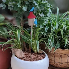 A birdhouse garden stake adds a touch of whimsy to any indoor planter. I love seeing how these little accessories bring a pot to life.