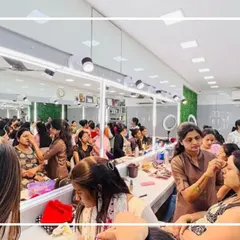 Our academy is always full of energy and creativity. Here you can see students fully engaged in a practical session, working on different looks.