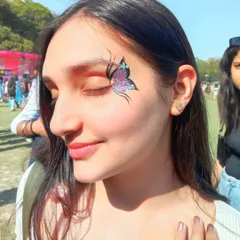 This design showcases a beautiful gradient of purple and blue glitter within the butterfly wings. The sunlight really makes the iridescent sparkles come alive.