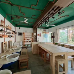 Welcome to our creative haven. I designed the studio to be a bright, inspiring, and comfortable space where you can focus on your craft. With plenty of natural light and dedicated stations, it’s the perfect place to get your hands dirty and let your creativity flow.