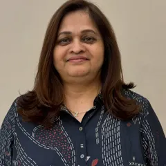 A happy client after her haircut. The soft layers around her face create a flattering shape and a lighter, more modern feel.