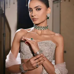 A powerful pose that captures the essence of this modern glam look. The combination of the heavily embellished outfit, diamond jewelry, and sculpted makeup is pure perfection.