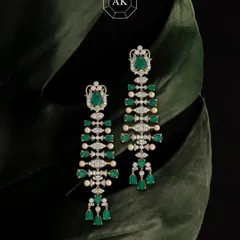 Elegance and emotion, captured in a single pair of earrings. Made with natural Zambian emeralds, Akoya pearls, and brilliant diamonds in 18K gold, these cascading earrings reflect hours of skilled craftsmanship and a passion for perfection.