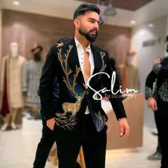For a client who wanted something powerful and unique for a reception, I created this black velvet tuxedo jacket. It features a stunning, large-scale deer motif, hand-embroidered with thread and beadwork to create a piece of wearable art.