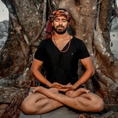 Meditating in Padmasana at the base of an ancient tree. This is where I connect with the foundational, grounding energy of yoga that I bring into every corporate and institutional session.