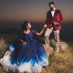 A dramatic sunset pre-wedding shoot on a hilltop. I provide couple costumes for rent, like this beautiful blue ombre gown and the matching red velvet blazer.
