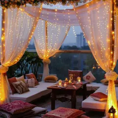 For this Sagan evening, I created a cozy and magical cabana draped in sheer fabric and wrapped in fairy lights. The low seating with traditional cushions offers an intimate setting against the city skyline, perfect for pre-wedding celebrations.