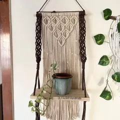 I love making pieces that are beautiful and useful! This macrame floating shelf is perfect for holding a small plant, some books, or your favorite little treasures. The dark brown and natural off-white cotton gives it a lovely contrast.