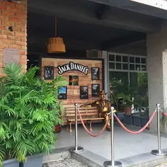 The entrance to the Pub Factory in Gurgaon, where I used large potted areca palms to create a lush, welcoming entryway that complements the venue's rustic theme.
