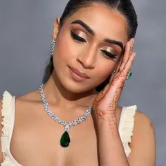Eyes closed, this shot highlights the beautiful gold shimmer and the precise winged liner taught in my advanced course.