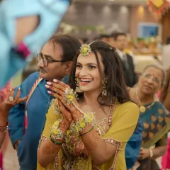 Dipped in turmeric and happiness. This candid shot captures the pure joy of a Haldi ceremony. The makeup is minimal and fresh, designed to withstand the playful rituals.