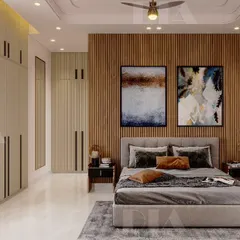 Natural wood tones bring warmth to this minimalist bedroom. A vertical wood slat accent wall is paired with sleek, floor-to-ceiling wardrobes, demonstrating how to combine texture with clean, functional storage solutions.