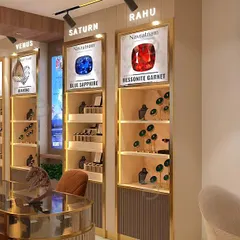A detailed render of the gemstone display units. Each section is dedicated to a specific stone, like Blue Sapphire and Hessonite Garnet, creating an educational and visually appealing shopping experience.