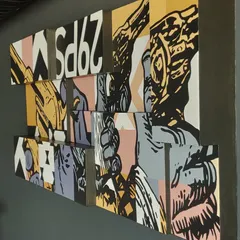 An angled shot of the Lounge29 pop art piece, showing how the different canvas depths create a 3D effect on the wall. This kind of custom wall decor adds a unique architectural element to a room.