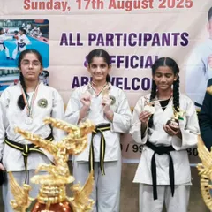 Three of my female students displaying their medals and trophies at the State Level Karate Tournament. They are powerful examples of skill and determination.
