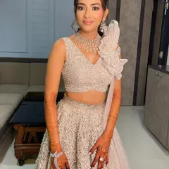 A textured ponytail with a statement diamond accessory for a reception look. This style is modern, chic, and keeps the hair beautifully styled yet out of the way.