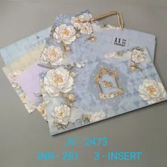 A beautiful invitation set with a carry bag, featuring a pattern of large white peonies on a dreamy blue background. This design is perfect for a romantic, floral-themed wedding.