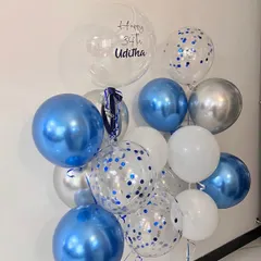 You're never too old to celebrate with balloons. This birthday bunch for a 34th birthday uses a cool palette of chrome blue, silver, and white, with a personalized bubble balloon.