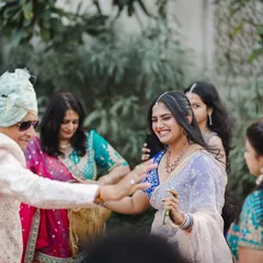 The bride's family dancing with joy during the baraat procession.