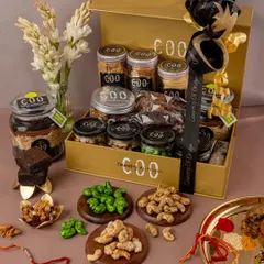 We styled and photographed this festive Rakhi hamper for a client. The shot is carefully composed to display a wide variety of products, from dry fruits to sweets, in an opulent and celebratory setting.