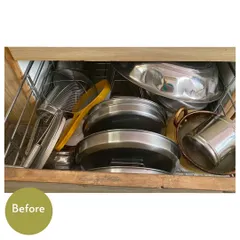 Before, this drawer was a messy pile of plates, lids, and strainers. This was part of a virtual kitchen organizing session.