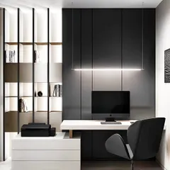 A sophisticated home office with a minimalist black and white theme. The design features a sleek, floating desk, a dark panelled accent wall, and a dramatic linear suspension light.