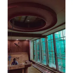 An in-progress shot from a hospital site, showing the installation of a circular stretch ceiling light. This behind-the-scenes view reveals the structural work that underpins our finished designs.