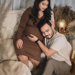 An intimate moment from a boho-themed studio session, where the father-to-be listens lovingly to the baby bump. These are the quiet, heartfelt memories I aim to preserve.