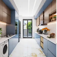 This galley kitchen combines dusty blue and wood-grain cabinets for a modern yet warm aesthetic. The layout leads to a balcony, providing excellent ventilation and natural light for the entire space.