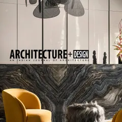 The Pool House project was also featured in Architecture+Design magazine. This image from the article highlights the bold material choices, like the dramatic marble bar and mustard yellow armchair.