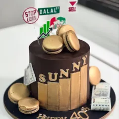 Celebrating a 40th birthday with a cake inspired by the hustle of Dalal Street. This custom trading themed cake features golden bar accents, edible currency, and rich chocolate macarons for a sophisticated touch.