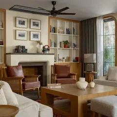 This living room from the House of Continuity shows our passion for restorative architecture. By reconfiguring the layout and enlarging the windows, we transformed an existing structure into a warm, inviting home that honors its past while embracing modern living.