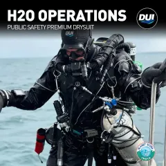 The DUI H2O Operations drysuit is engineered for public safety divers who face the most challenging conditions. This image shows a fully equipped operator, highlighting the suit's integration with tactical gear, its rugged build for hazardous water, and the mobility it provides for critical tasks.